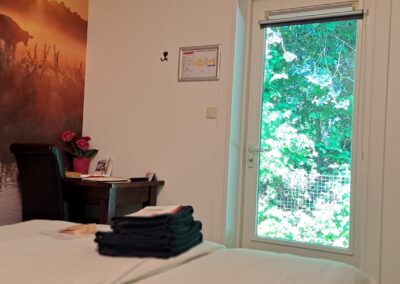 Kamer 3 wand, bed en uitzicht